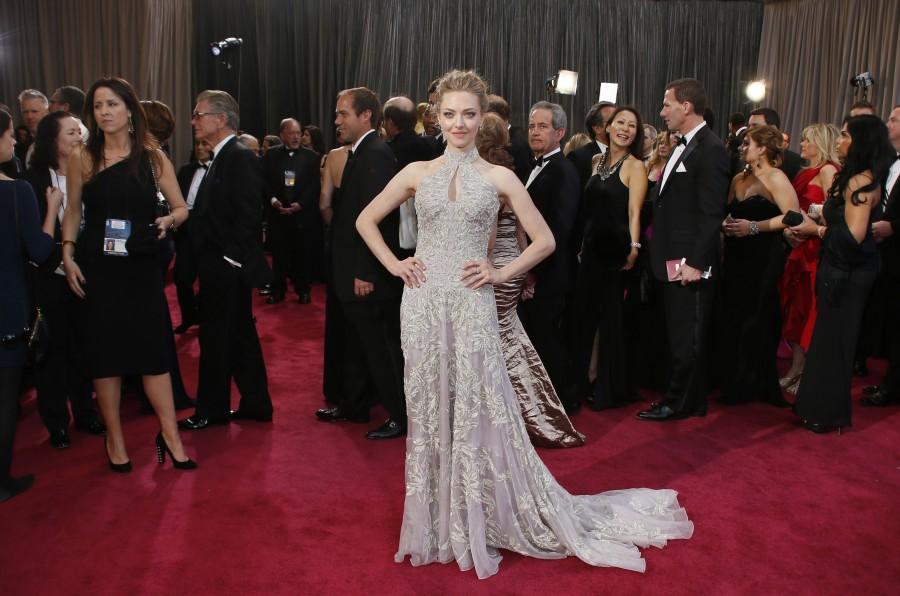Another stunning red carpet appearance is by Amanda Seyfried when she attended Oscars wearing Alexander McQueen gown. Oscars 2017,Oscars red carpet,Oscars best dressed celebrities,red carpet look,Jennifer Lawrence,kate Hudson,Anne Hathway,Penelope Cruz,Gwyneth Paltrow,Amanda Seyfried,Jennifer Aniston,Lupita Nyong'o