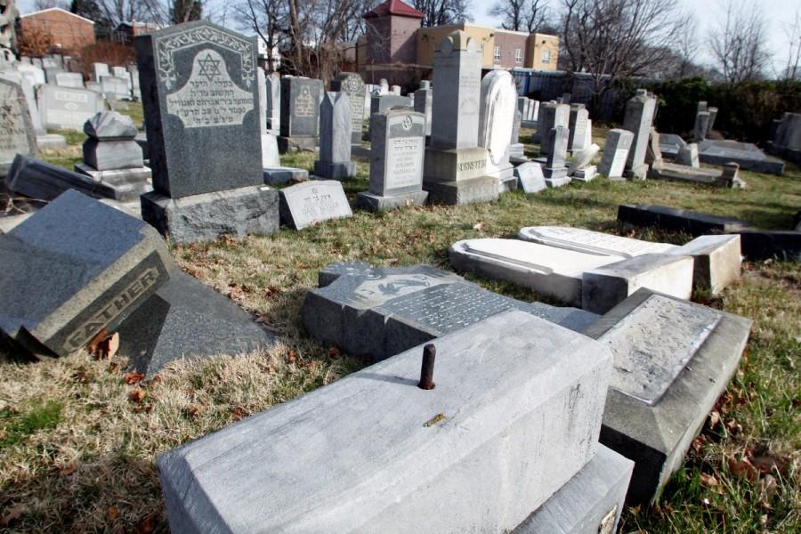 Headstones lay on the ground after vandals pushed them off their bases in the Mount Carmel Cemetery in Philadelphia. Jewish cemetery,Jewish cemetery vandalized,Jewish vandalized,Philadelphia,Jewish cemetery in St. Louis,St. Louis