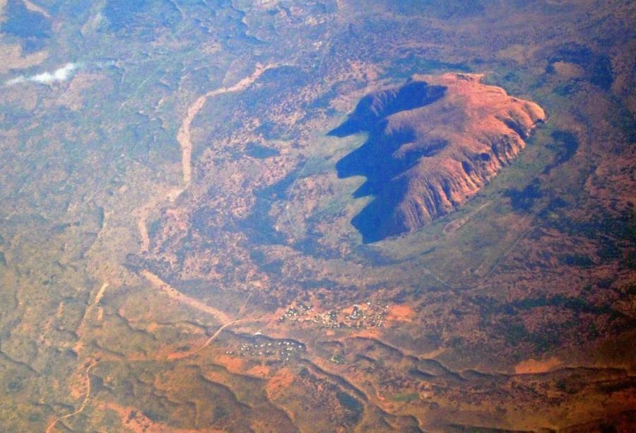 The Indigenous Australian community of Mutitjulu can be seen on the eastern side of Uluru, also known as Ayers Rock, in this aerial photo taken in the Northern Territory, Australia. Australia from the air,Australia from air,Australia from above,Australia,Awesome Australia,Australia from above pics,Australia from above images,Australia from above photos,Australia from above stills,Australia from above pictures