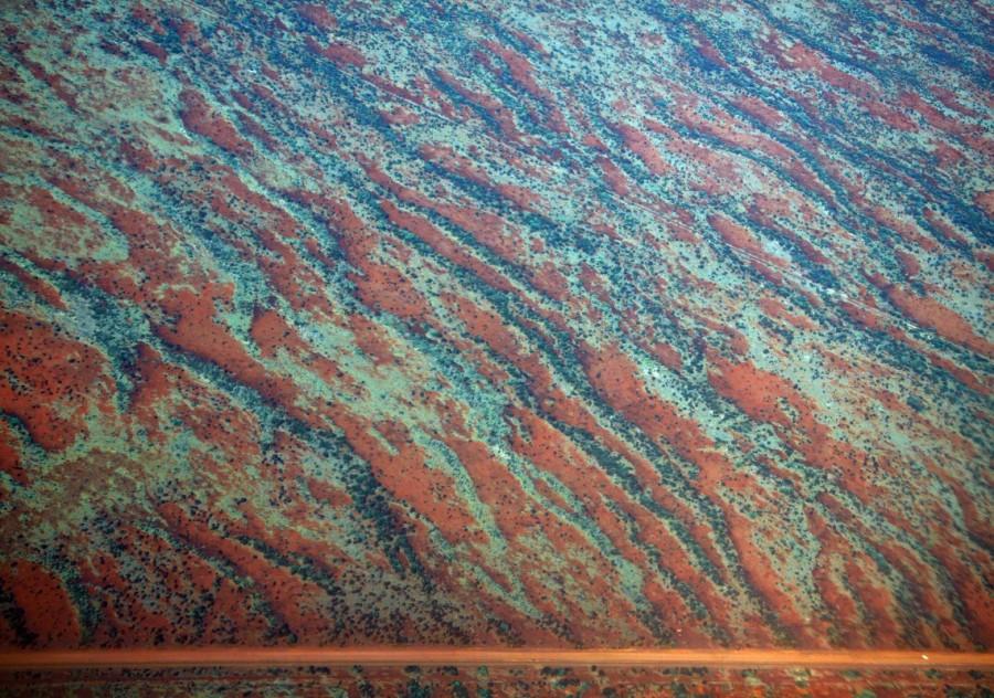 A general view of a road next to sand dunes covered in vegetation in the Pilbara region of Western Australia. Australia from the air,Australia from air,Australia from above,Australia,Awesome Australia,Australia from above pics,Australia from above images,Australia from above photos,Australia from above stills,Australia from above pictures