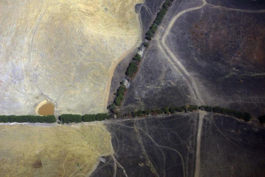 A small dam containing water is seen in a dry paddock next to another that has been affected by a fire on the outskirts of Melbourne. Australia from the air,Australia from air,Australia from above,Australia,Awesome Australia,Australia from above pics,Australia from above images,Australia from above photos,Australia from above stills,Australia from above pictures
