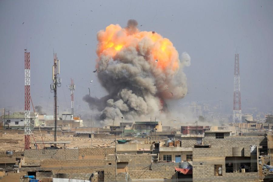Smoke rises after an airstrike, during the battle against Islamic State militants, at the district of al-Mamoun in Mosul, Iraq, March 1, 2017. Tigris river,Brutal street,Mosul,U.S,Islamic State,damaged bridge,Iraqi special forces,Iraqi forces,Iraqi special forces in Mosul