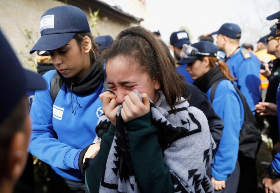 A pro-settlement activist reacts during an operation by Israeli forces to evict residents from several homes in the Israeli settlement of Ofra, in the occupied West Bank February 28, 2017. Israel,Israeli police,Palestinian land,West Bank,Ofra