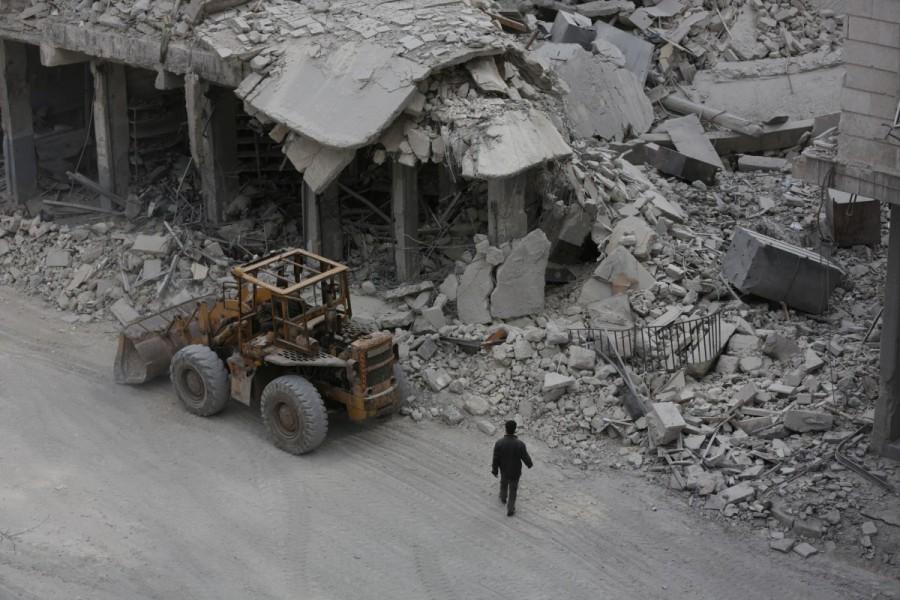 A man walks near rubble of damaged buildings in the northern Syrian town of al-Bab, Syria March 1, 2017. Syria,Al-Bab after Islamic State,Islamic State,Syrian city,Islamic State militants,Turkish-backed rebels