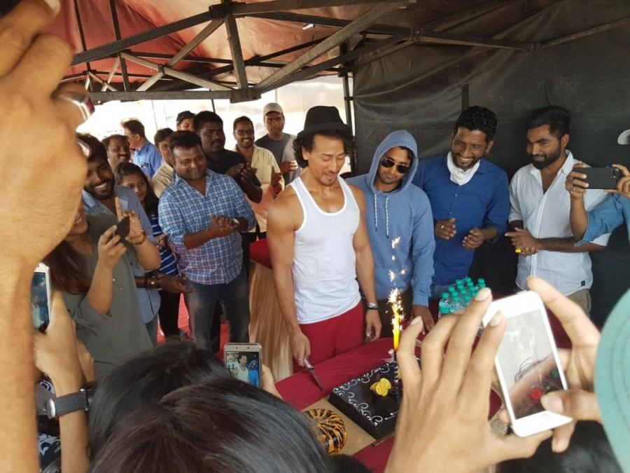 On hearing about the surprise visit, Tiger took a break from his shoot and spent some time with all of them. He cut his birthday cake with them, took pictures and also asked if they would like to sit and watch his shoot. He was overwhelmed with all the gifts and wishes and thanked them for coming all the way. Tiger Shroff,Tiger Shroff birthday,Tiger Shroff birthday celebrations,Tiger Shroff birthday celebration pics,Tiger Shroff birthday celebration images,Tiger Shroff birthday celebration photos,Tiger Shroff birthday celebration stills,Tiger Shroff birthday c