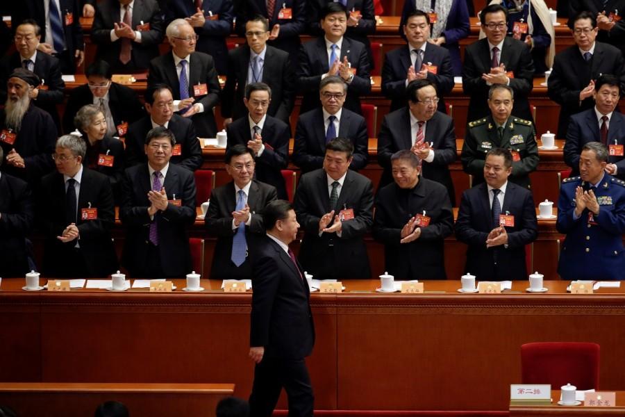 Delegates clap their hands as China's President Xi Jinping (1st row) arrives for the opening session of the Chinese People's Political Consultative Conference (CPPCC) at the Great Hall of the People in Beijing, March 3, 2017. Congress meets,China Congress meets,Chinese People,Consultative Conference,Beijing