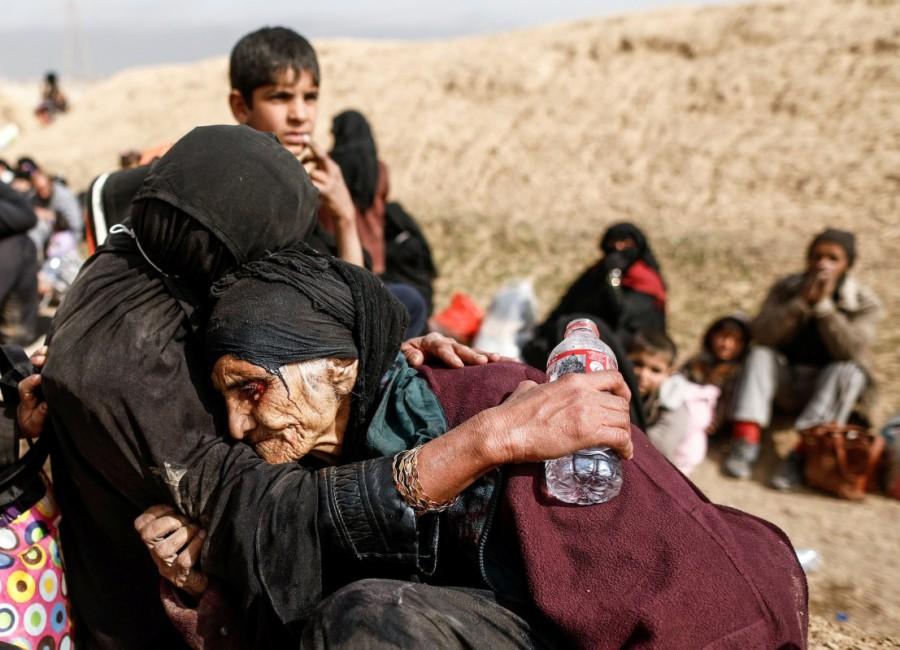 Khatla Ali Abdullah, 90, is embraced as she flees her home as Iraqi forces battle with Islamic State militants in western Mosul, Iraq. Ninety-year-old Khatla Ali Abdallah,Khatla Ali Abdallah,Mosul,Islamic State