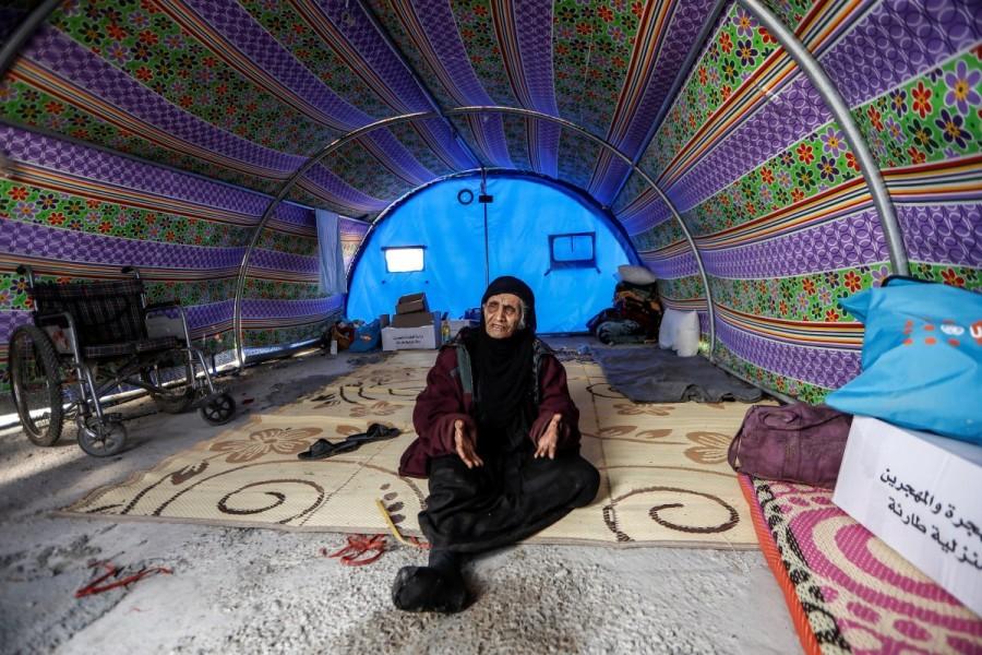 Khatla Ali Abdullah, 90, who recently fled her home in Al Mamoun district speaks with a Reuters journalist as she sits in her tent in Hammam al Alil camp, while Iraqi forces battle with Islamic State militants, in western Mosul, Iraq. Ninety-year-old Khatla Ali Abdallah,Khatla Ali Abdallah,Mosul,Islamic State