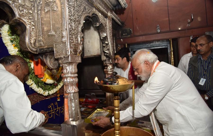 After offering milk, Ganga jal, flowers, chandan and janeyu, the Prime Minister performed aarti. The priests then smeared Modi's forehead with chandan and vermillion, as a symbol of blessings of the Lord Kashi Vishwanath. He was also given some prasad by the management of the temple. He later left for the Kaal Bhairav temple, which is considered to be a very holy place in the temple town. Kaal Bhairav is considered by devotees as the 'shah kotwal' and it is believed that a trip to Varanasi is incomplete without a visit to this temple. Narendra Modi,Narendra Modi at Varanasi,Narendra Modi at Kaal Bhairav Temple,Kaal Bhairav Temple,Narendra Modi offers prayers at Kaal Bhairav Temple,Narendra Modi offers prayers at Varanasi