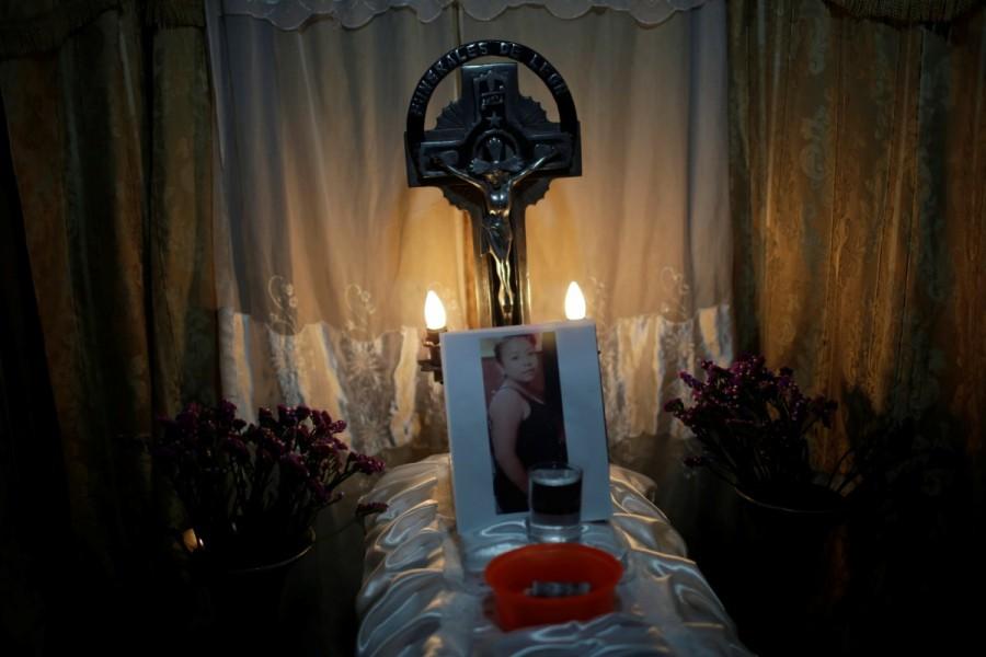 The coffin of Madelin Patricia Hernandez is seen during her wake in Guatemala City. The Virgen de la Asuncion home houses youths up to 18 years old on the pine-wooded outskirts of the municipality of San Jose Pinula, some 25 kilometers (15 miles) southwest of the capital Guatemala City. Its residents are an unusual mix of victims of violence and young offenders, with children with disabilities in another wing. Mourning girls,Guatemala mourns,death under lock,Madelin Patricia Hernandez,Guatemala City