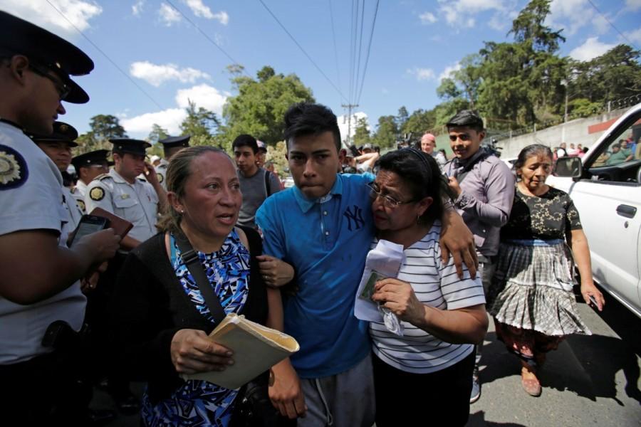 Daniel, 16, survivor of the fire, exits the Virgen de Asuncion home. The government has sacked the director of the Virgen de la Asuncion home, temporarily closed the center, declared three days of mourning and vowed to reform a childcare system that experts say is critically underfunded. Mourning girls,Guatemala mourns,death under lock,Madelin Patricia Hernandez,Guatemala City