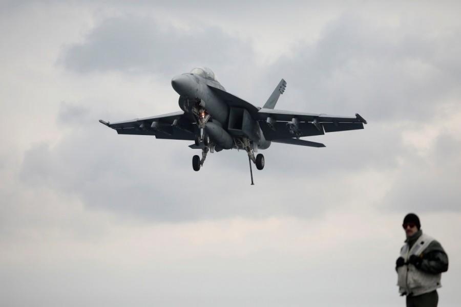 A U.S. F18 fighter jet approaches the deck of U.S. aircraft carrier USS Carl Vinson during an annual joint military exercise called "Foal Eagle" between South Korea and U.S., in the East Sea, South Korea. U.S. aircraft,U.S. aircraft joins South Korea,South Korea drills,U.S.-South Korean drills,merciless,North Korea,North Korea warns the United States,Navy F18,U.S. Navy F18