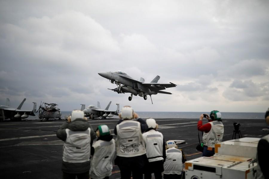 A U.S. F18 fighter jet lands on the deck of U.S. aircraft carrier USS Carl Vinson during an annual joint military exercise called "Foal Eagle" between South Korea and U.S., in the East Sea, South Korea. U.S. aircraft,U.S. aircraft joins South Korea,South Korea drills,U.S.-South Korean drills,merciless,North Korea,North Korea warns the United States,Navy F18,U.S. Navy F18