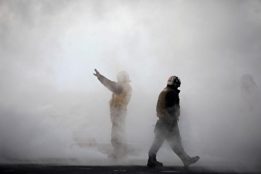 A U.S. Navy crew member guides a U.S. Navy F18 fighter jet to take off from the deck of U.S. aircraft carrier USS Carl Vinson during an annual joint military exercise called "Foal Eagle" between South Korea and U.S., in the East Sea, South Korea. U.S. aircraft,U.S. aircraft joins South Korea,South Korea drills,U.S.-South Korean drills,merciless,North Korea,North Korea warns the United States,Navy F18,U.S. Navy F18