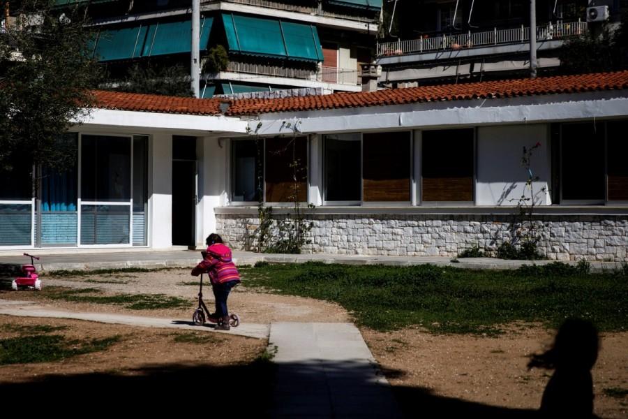 Children play in the yard of the Model National Nursery of Kallithea. Impoverished Greek,Greek,group homes,economic crisis