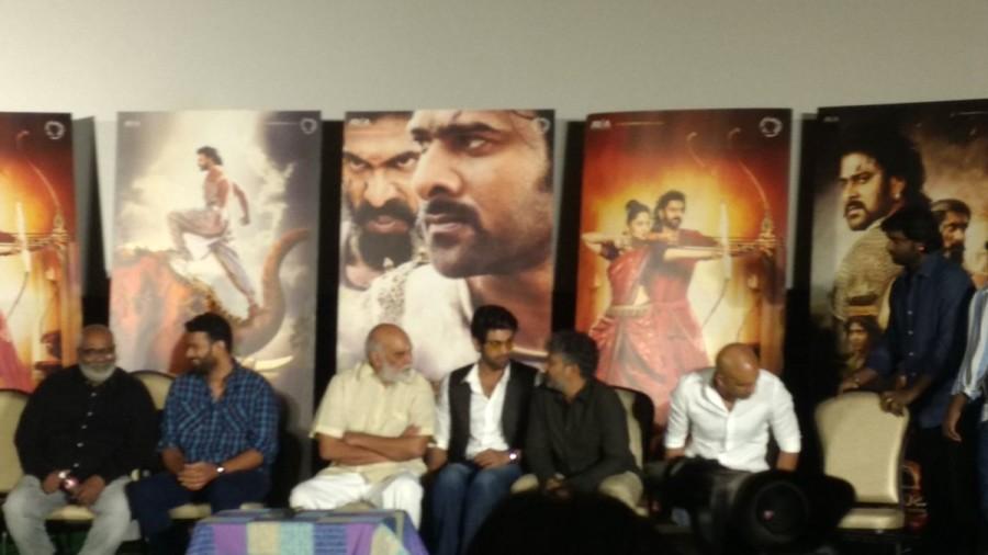 The sword was presented to Karan Johar as a token of association with the Baahubali franchise. In 2015, southern producers Shobu Yarlagadda and Prasad Devineni and Bollywood director Karan johar joined forces to present to the Indian audience an Indian cinematic experience, that was Baahubali. Two years later, the producers reunited along with director SS Rajamouli, lead actor Prabhas and antagonist Rana Daggubati in addition to Anil Thadani, introducing the audience to yet another magnum opus experience in the form of the trailer of Baahubali : The Conclusion. Prabhas,Rana Daggubati,SS Rajamouli,Bahubali 2 trailer launch,Bahubali 2 trailer,Bahubali 2 trailer launch pics,Bahubali 2 trailer launch images,Bahubali 2 trailer launch photos,Bahubali 2 trailer launch stills,Bahubali 2 trailer launch pictures
