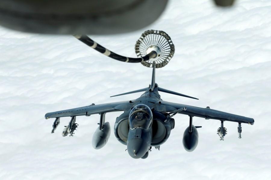 A U.S. Marines Harrier AV-8B makes its way to a fueling boom suspended from a U.S. Air Force KC-10 Extender during mid-air refueling support to Operation Inherent Resolve over Iraq and Syria air space. Americans fight Islamic State,Americans fight,Islamic State,Iraq and Syria,Iraq,Syria,U.S. forces