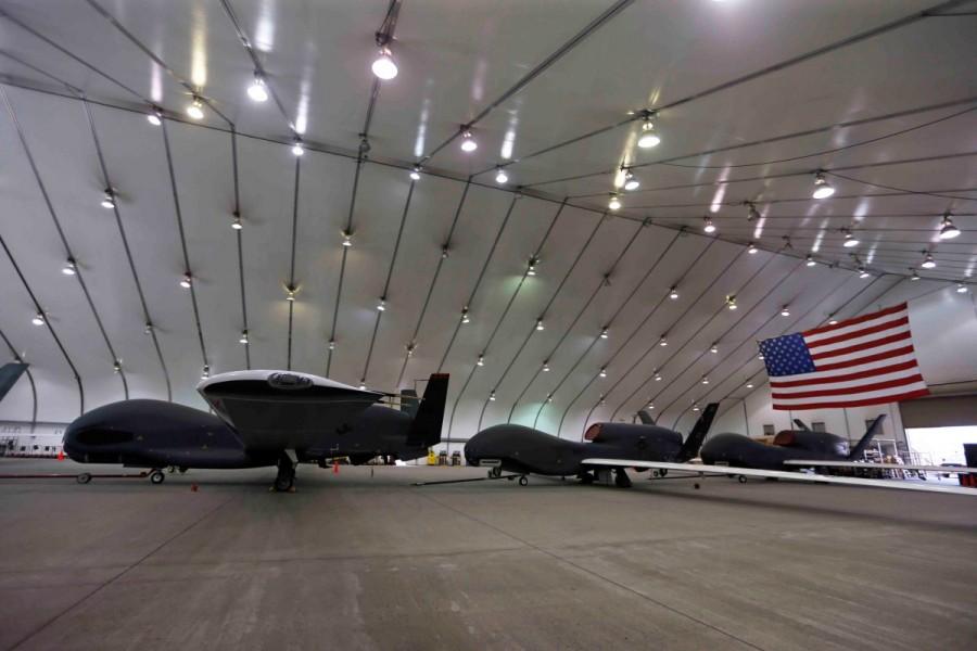 U.S. Air Force RQ-4 Global Hawk aircraft wait in a hangar on a military installation at an Air Force Base in the Arabian Gulf. Americans fight Islamic State,Americans fight,Islamic State,Iraq and Syria,Iraq,Syria,U.S. forces
