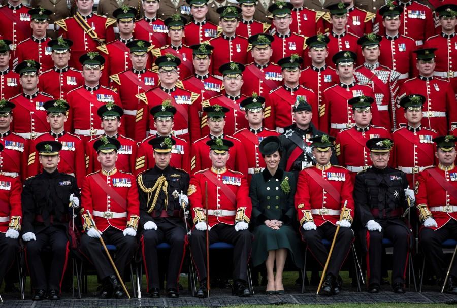 Britain's Prince William and Catherine, the Duchess of Cambridge, sit for an official photograph with warrant officers of the 1st Battalion Irish Guards following their St Patrick's Day parade at Cavalry Barracks, Hounslow on Friday, 17th March 2017. St Patrick’s Day,St Patrick’s Day 2017,St Patrick’s Day photos,irish holiday,St Patrick’s Day holiday,people celebrate St Patrick’s Day,St Patrick’s Day green,photos,Duchess of Cambridge,prince william,Catherine,St Patrick’s Day parade