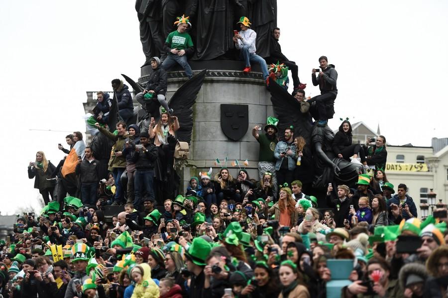 People watch the St. Patrick's day parade in Dublin, Ireland March 17, 2017. St Patrick’s Day,St Patrick’s Day 2017,St Patrick’s Day photos,irish holiday,St Patrick’s Day holiday,people celebrate St Patrick’s Day,St Patrick’s Day green,photos,Duchess of Cambridge,prince william,Catherine,St Patrick’s Day parade