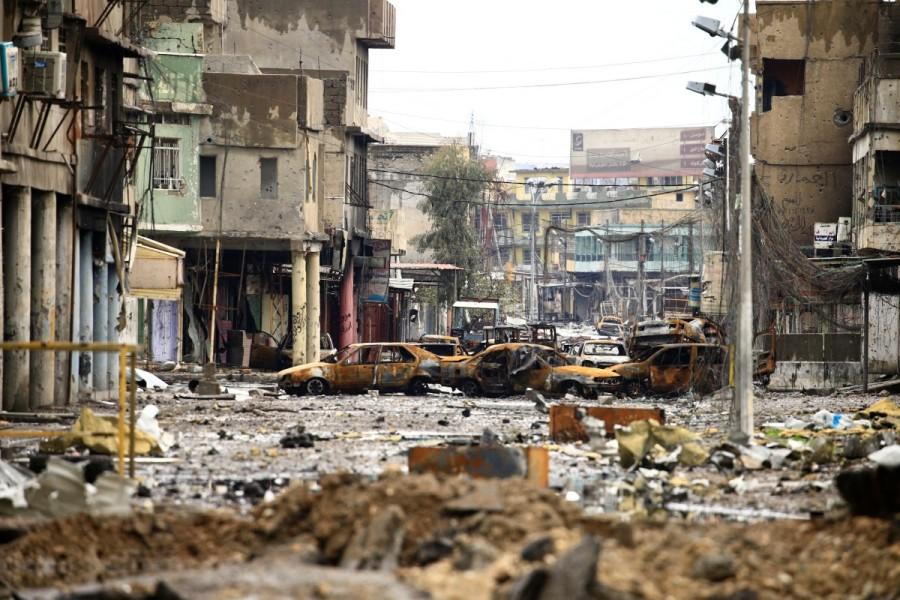 Cars burnt and destroyed by clashes are seen on a street during a battle between Iraqi forces and Islamic State militants, in Mosul. Iraqi forces,Mosul,Iraqi forces edge further into Mosul,Iraqi forces attack,Iraqi Air Force