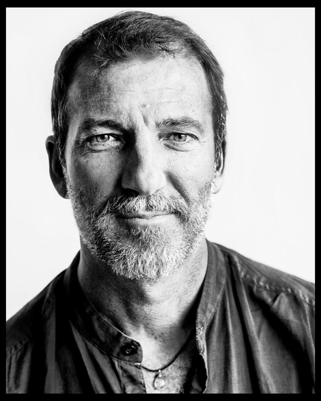 Mark Bennington is a trained actor hailing from New York City who took to photography in 2004 and has since then gained rampant repute for his unique style of photography. Mark's latest work comes in the form of a unique photography book titled Living the Dream: The Life of the 'Bollywood' Actor which has recently been published and released as a coffee table book by Harper Collins India. Mark is a trained actor who was working for over 10 years in America before becoming a photographer. He has even tried his hands out as an actor himself in Bollywood with two feature films including Dibakar Banerjee's Detective Byomkesh Bakshy. Mark Bennington,Mark Bennington's iconic photos,Mark Bennington's iconic pics,Mark Bennington's iconic images,Mark Bennington's iconic stills,Mark Bennington's iconic pictures