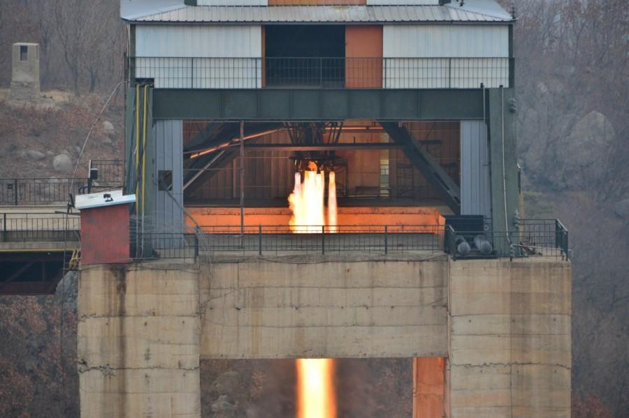 North Korean leader Kim Jong Un watched the ground jet test of a Korean-style high-thrust engine newly developed by the Academy of the National Defence Science in this undated picture provided by KCNA in Pyongyang on March 19, 2017. North Korea,secretive missile program,missile program,North Korea's secretive missile program,North Korea missile program,North Korea missile program pics,North Korea missile program images,North Korea missile program photos,North Korea missile progr
