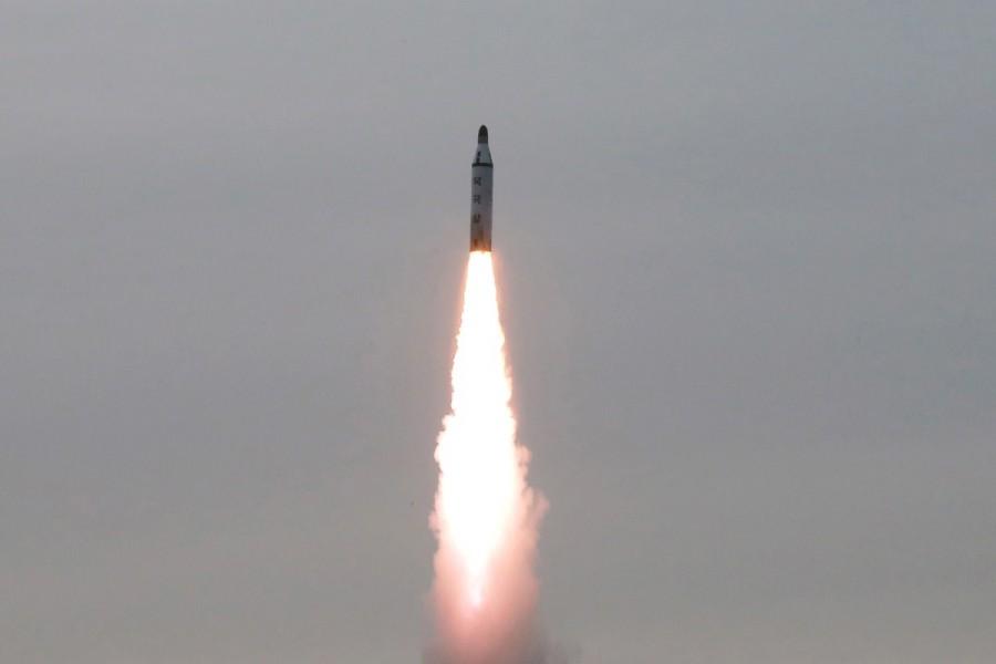 North Korean leader Kim Jong Un guides on the spot the underwater test-fire of strategic submarine ballistic missile in this undated photo released by North Korea's Korean Central News Agency. North Korea,secretive missile program,missile program,North Korea's secretive missile program,North Korea missile program,North Korea missile program pics,North Korea missile program images,North Korea missile program photos,North Korea missile progr