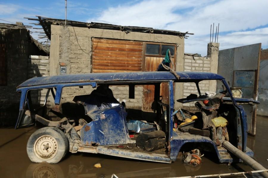 A vehicle is seen, after rivers breached their banks due to torrential rains, causing flooding and widespread destruction in Huarmey, Ancash, Peru, March 21, 2017. Peru,Peru floods,Peru landslides,Floods,landslides spread havoc in Peru,Floods,landslides in Peru