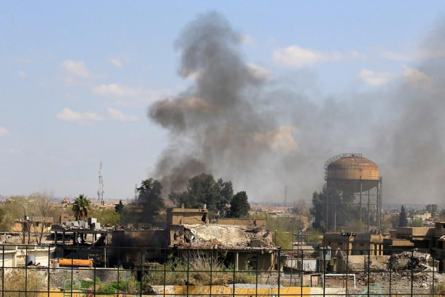 Smoke rises from from the old city during a battle against Islamic State militants, in Mosul. Iraqi forces into Mosul,Iraqi forces edge further into Mosul,Mosul,Iraqi forces enter Mosul,Islamic State militants,Islamic militants