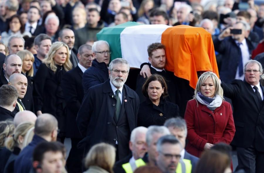 Sinn Fein President Gerry Adams (C) walks next to the coffin of Martin McGuinness during his funeral in Londonderry, Northern Ireland. Northern Ireland,Ireland buries Martin McGuinness,Martin McGuinness,Irish Republican Army,Martin McGuinness dies,Martin McGuinness tributes,Martin McGuinness dead