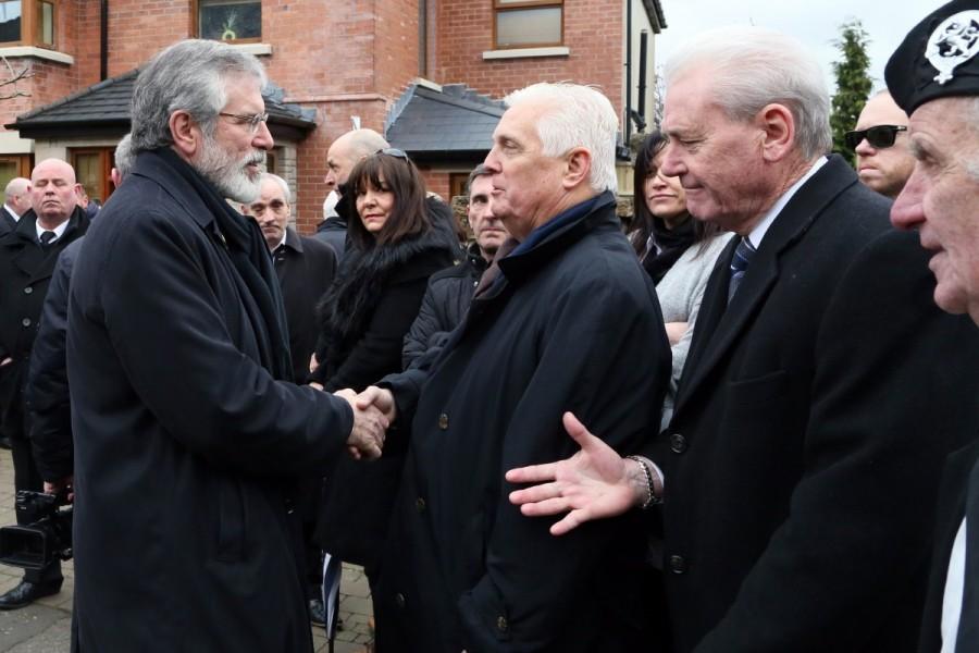 Sinn Fein President Gerry Adams (L) greets U.S. mourners outside the home of Martin McGuinness, in Londonderry. Northern Ireland,Ireland buries Martin McGuinness,Martin McGuinness,Irish Republican Army,Martin McGuinness dies,Martin McGuinness tributes,Martin McGuinness dead