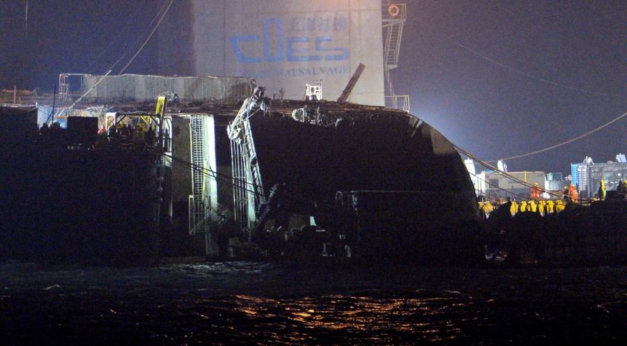 The sunken ferry Sewol is seen during its salvage operations at the sea off Jindo, South Korea March 23, 2017. Sunken South Korea,South Korea ferry raised,South Korea ferry,Sewol ferry,Sewol ferry sank,Sewol ferry salvage,sewol ferry disaster