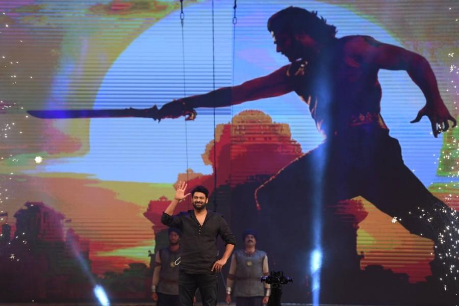 Baahubali 2: The Conclusion movie Pre Release event held at Ramoji Film City in Hyderabad. Actor Prabhas spotted suring the event. Prabhas at Baahubali 2,Prabhas Baahubali 2,Baahubali 2 movie pre-release event,Baahubali 2 pre-release event,Baahubali 2 pre-release event pics,Baahubali 2 pre-release event images,Baahubali 2 pre-release event stills,actor Prabhas,Prabhas pics,Prabhas im
