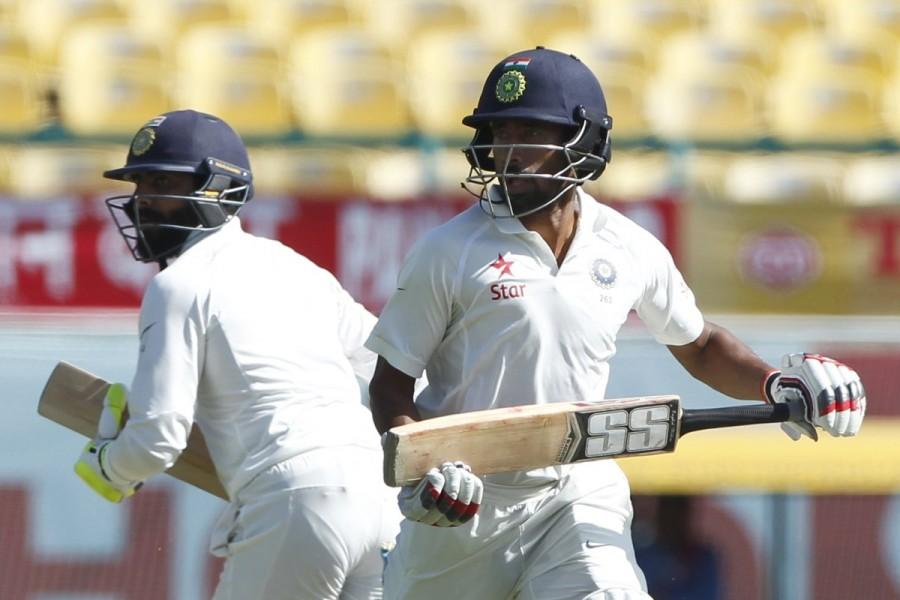 Cummins bowled a wide length ball which Jadeja tried to drive without using his feet and guided a thick inside edge onto the stumps. Incoming batsmen Bhuvneshwar Kumar departed in the next over without disturbing the score. He was sent packing by left-arm spinner Steve O'Keefe. O'Keefe, who took the wicket in his first over of the day, tossed the ball and Kumar drove on the up and away from the body to give a simple catch to skipper Steve Smith. India vs Australia,india vs australia test series 2017,india vs australia live,India vs Australia 4th Test,India vs Australia score,India vs Australia pics,India vs Australia images,India vs Australia stills,India vs Australia pictures