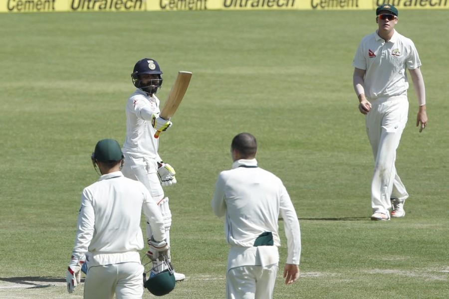 Saha, who seemed good at the crease was the next one to go. He was dismissed by Cummins when the scoreboard was reading 318/9. His 102-ball knock was laced with only two boundaries. Tailenders Umesh Yadav (2 not out) and debutant Kuldeep Yadav (7), however, added 14 runs for the last wicket to frustrate Australian bowlers and helped India to get past 330-run mark. India vs Australia,india vs australia test series 2017,india vs australia live,India vs Australia 4th Test,India vs Australia score,India vs Australia pics,India vs Australia images,India vs Australia stills,India vs Australia pictures