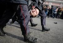 Law enforcement officers detains an opposition supporter during a rally in Moscow.