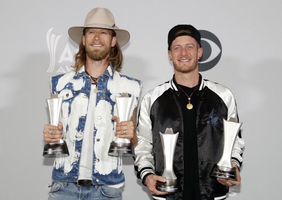 Florida Georgia Line poses backstage with their Single Record of the Year award for H.O.L.Y. and Vocal Event of the Year for "May We All". Brian Kelley,Jason Aldean,Miranda Lambert,ACM Awards 2017 winners,ACM Awards 2017,ACM Awards winners,ACM Awards,Academy of Country Music,Academy of Country Music winners,Academy of Country Music 2017
