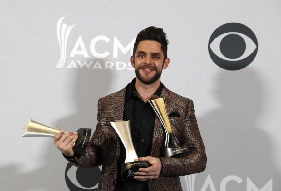 Singer Thomas Rhett poses backstage with his awards including Song of the Year for "Die a Happy Man" and Male Vocalist of the Year. Brian Kelley,Jason Aldean,Miranda Lambert,ACM Awards 2017 winners,ACM Awards 2017,ACM Awards winners,ACM Awards,Academy of Country Music,Academy of Country Music winners,Academy of Country Music 2017