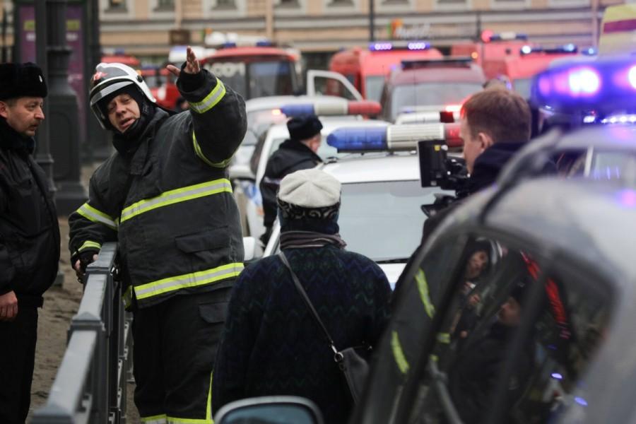 Emergency services direct pedestrians outside Sennaya Ploshchad metro station, following explosions in two train carriages at metro stations in St. Petersburg, Russia. St Petersburg,St Petersburg blast,St Petersburg metro railway blasts,St Petersburg explosions,Russia St Petersburg train blasts injured,metro blast,Russian city of St Petersburg