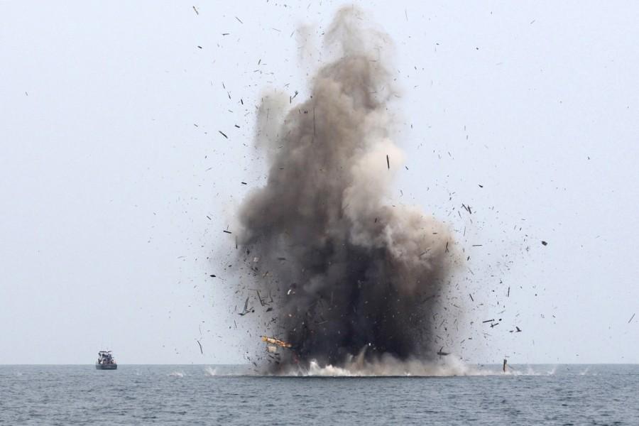 Three Malaysian fishing boats are destroyed for illegal fishing, by the Ministry of Maritime Affairs and Fisheries along with the police and navy, near Langsa, Aceh province, Indonesia. Indonesia,illegal fishing boats,fishing boats,destroys illegal fishing boats,Indonesian navy