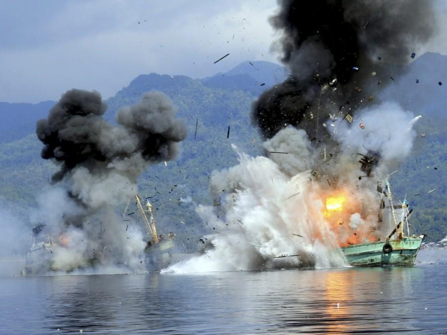 Two foreign flagged fishing boats registered in Papua New Guinea are destroyed by the Indonesian Navy after they were seized for supposedly illegal fishing off the coast of Ambon, Maluku. Indonesia,illegal fishing boats,fishing boats,destroys illegal fishing boats,Indonesian navy
