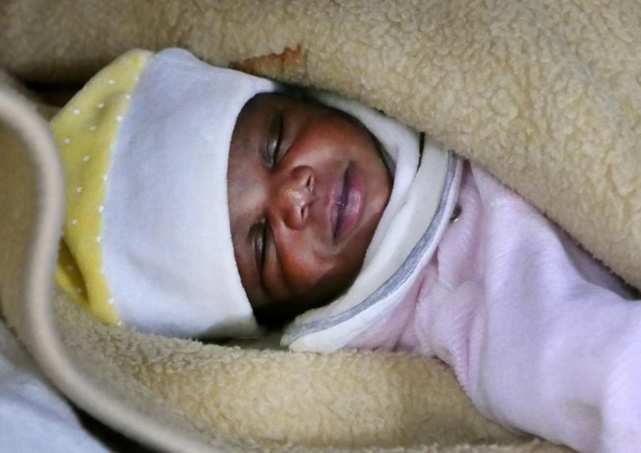 A migrant baby girl is seen sleeping aboard the former fishing trawler Golfo Azzurro, about thirty-two hours after her rescue along other migrants from their drifting plastic rafts by Spanish NGO Proactiva Open Arms, in the Mediterranean Sea, off the Libyan coast April 2, 2017. The four day-old baby was one of over 480 migrants rescued by humanitarian ships on Saturday during search and rescue operations in the central Mediterranean Sea. Mediterranean,Mediterranean sea,480 migrants rescued,Baby migrants,migrants