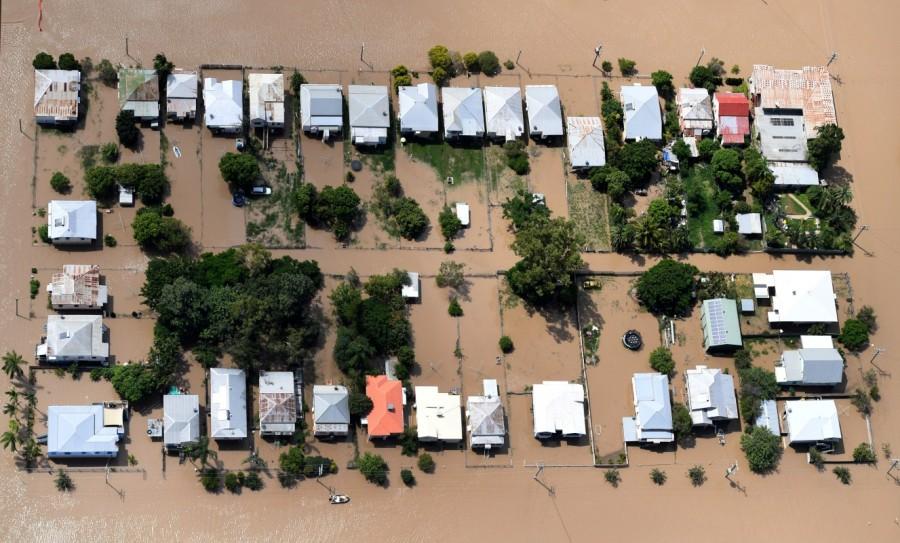 Houses are surrounded by floodwaters brought on by Cyclone Debbie at Depot Hill in Rockhampton. Queensland,Australia after Cyclone Debbie,Cyclone Debbie,Cyclone Debbie effect,flood in Australia,Australia flood,australia flooding