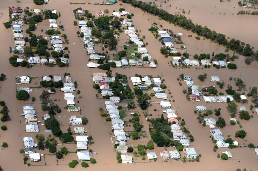 Houses are surrounded by floodwaters brought on by Cyclone Debbie in Rockhampton. Queensland,Australia after Cyclone Debbie,Cyclone Debbie,Cyclone Debbie effect,flood in Australia,Australia flood,australia flooding