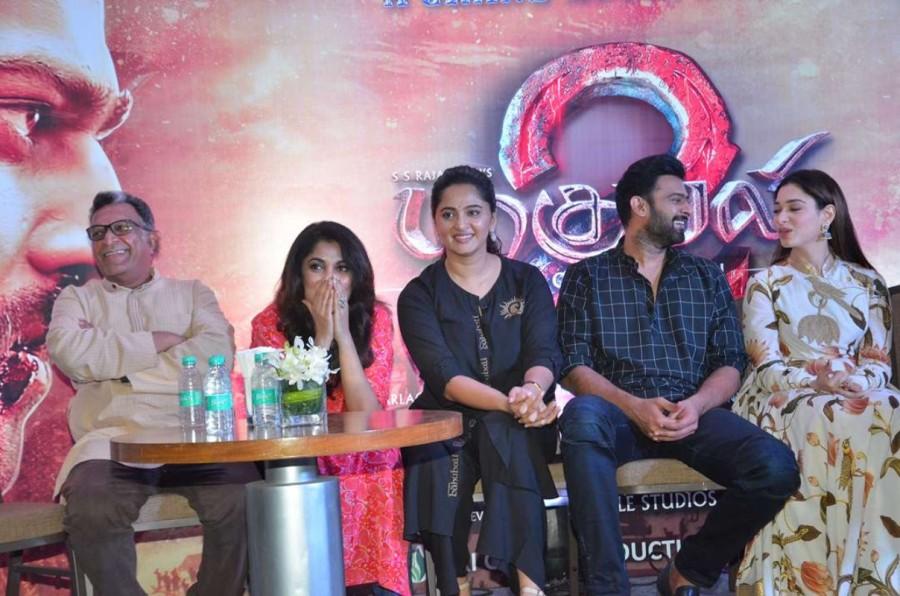 Tamil movie Baahubali 2 audio launch event held at Chennai. Celebs like Prabhas, Anushka Shetty, Tamannaah, SS Rajamouli, Sathyaraj, Ramya Krishnan, Nassar, Rama Rajamouli, MM Keeravani, Srivalli Keeravaani, K Raghavendra Rao, Keyaar, RK Suresh, RJ Balaji, Dhananjayan, Rajesh M Selva, Nirosha, Ramki, Dhanush, Kalaipuli S Thanu, Kabilan Vairamuthu, Madhan Karky, Yuvan Shankar Raja, Krishna Kulasekaran and others graced the event. SS Rajamouli,Prabhas,Anushka Shetty,Tamannaah,Ramya Krishnan,Baahubali 2,Baahubali 2 audio launch,Baahubali 2 audio launch pics,Baahubali 2 audio launch images,Baahubali 2 audio launch stills,Baahubali 2 audio launch pictures,Baahubali 2 audio launch phot