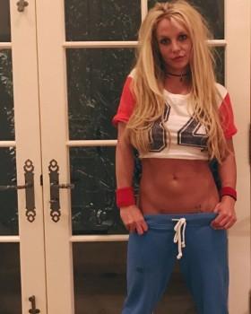 Britney Spears shows off her impressive abs and cheeky tattoos.
