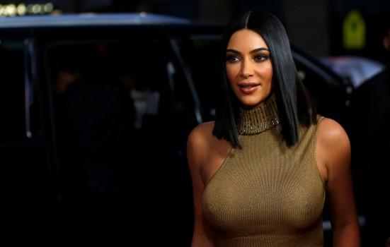 Television personality Kim Kardashian poses at the premiere of 