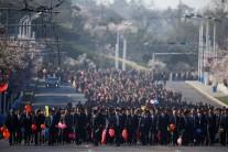 Thousands of people arrive for an opening ceremony of a newly constructed residential complex in Ryomyong street.