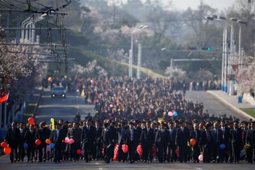 Thousands of people arrive for an opening ceremony of a newly constructed residential complex in Ryomyong street.